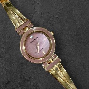 Anne Klein Gold Tone Watch with Pink Dial Diamond Accent